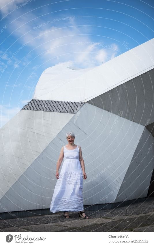 Rocky skywards Human being Feminine Woman Adults Female senior 1 45 - 60 years Architecture Sky Clouds Summer Beautiful weather Wall (barrier) Wall (building)