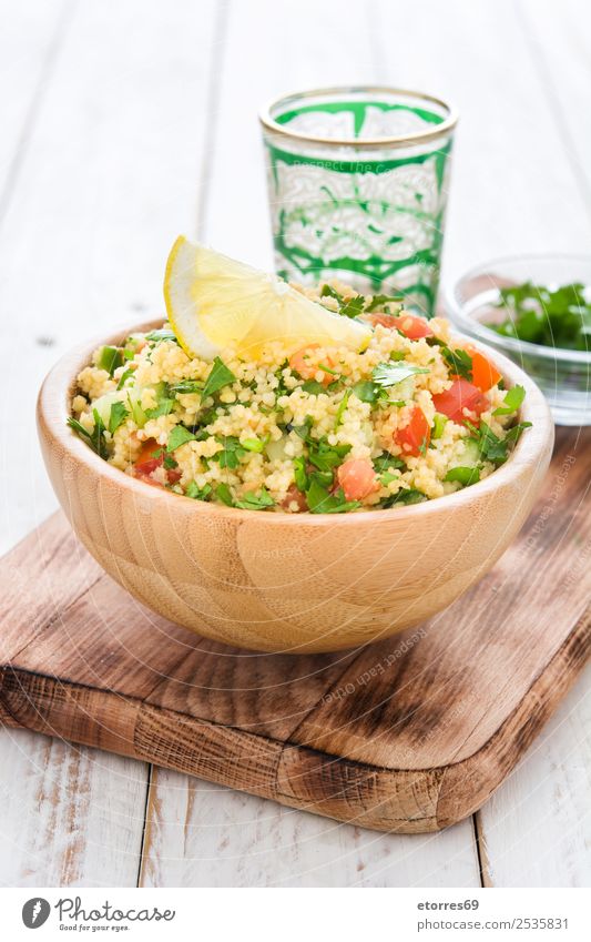 Tabbouleh salad in bowl on white wood Table Salad couscous Vegetable Tomato Cucumber Parsley Mint Vegan diet Vegetarian diet Healthy Eating Nutrition Diet Bowl