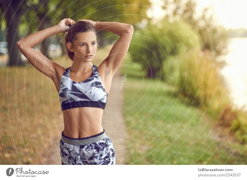 Slim athletic woman jogging by the lake Lifestyle Happy Summer Sports Jogging Woman Adults 1 Human being 18 - 30 years Youth (Young adults) Warmth Park Lake