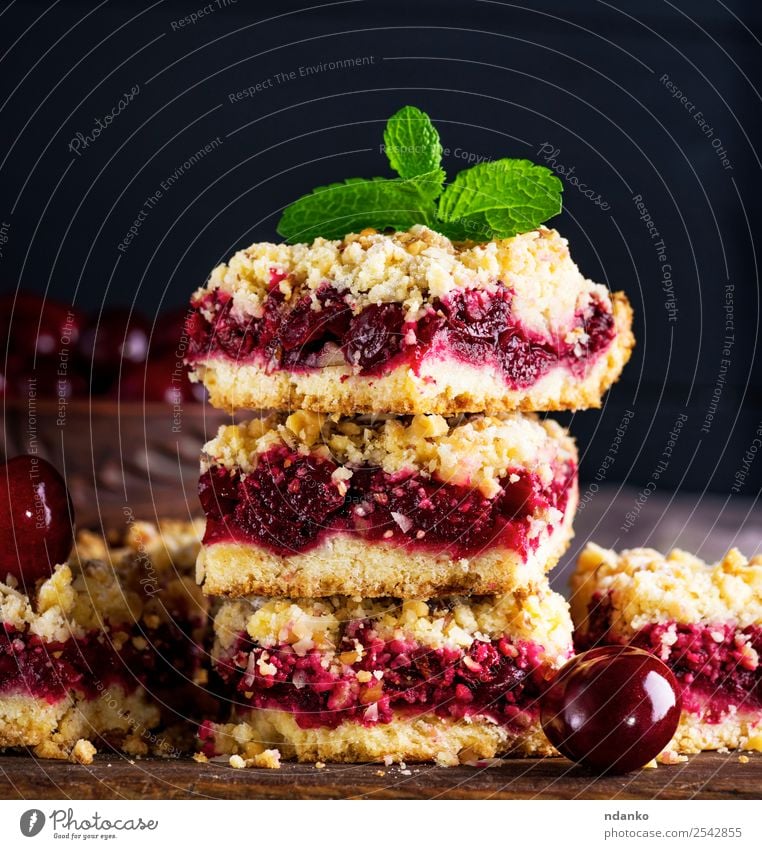 pile of baked cake with cherry Fruit Cake Dessert Candy Vegetarian diet Table Wood Fresh Delicious Brown Yellow Green Red Black crumble Cherry Pie Baked goods