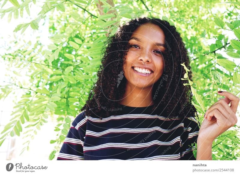 Young happy woman surrounded by green leaves Lifestyle Style Design Beautiful Hair and hairstyles Face Healthy Wellness Well-being Contentment Human being