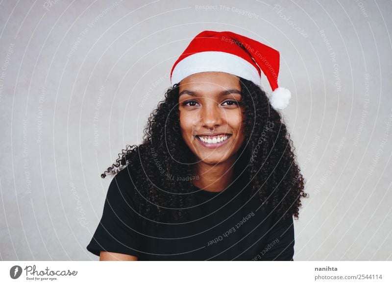 Young woman with a santa's hat Style Design Joy Feasts & Celebrations Christmas & Advent New Year's Eve Human being Feminine Youth (Young adults) Woman Adults 1