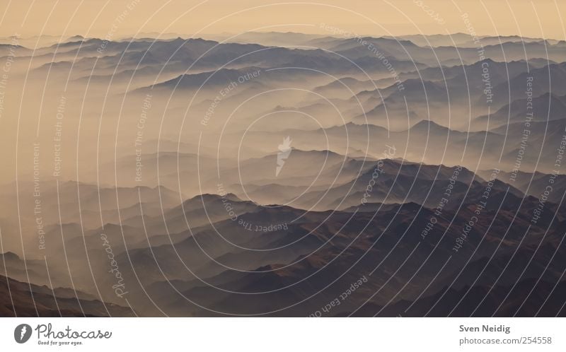 the Sea of Fog I Nature Earth Clouds Alps Mountain Peak Infinity Blue Yellow Sublime Colour photo Aerial photograph Structures and shapes Deserted Dawn Sunrise