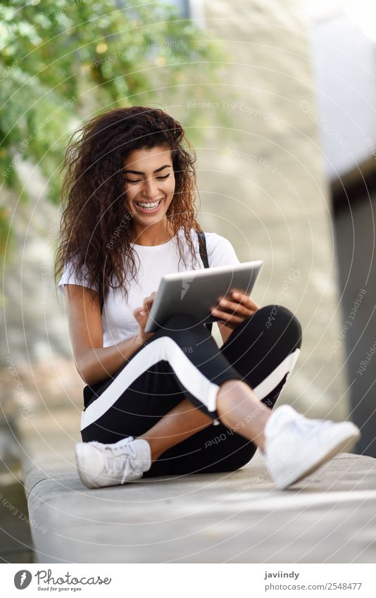 Young African woman with looking at her digital tablet Lifestyle Style Happy Beautiful Hair and hairstyles Tourism Technology Internet Human being Feminine