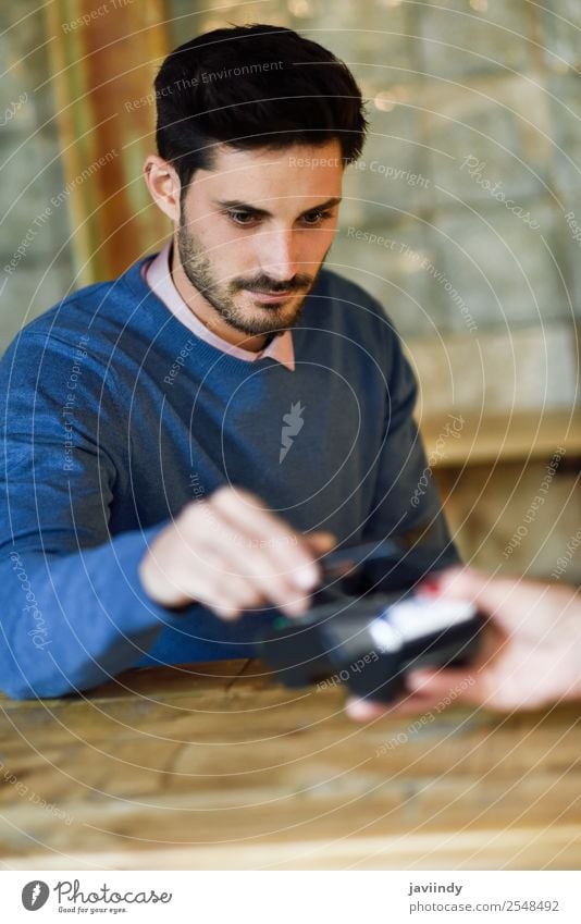 Hand holding smartphone paying on EDC machine. Shopping Money Financial institution Business Telephone PDA Technology Human being Masculine Young man