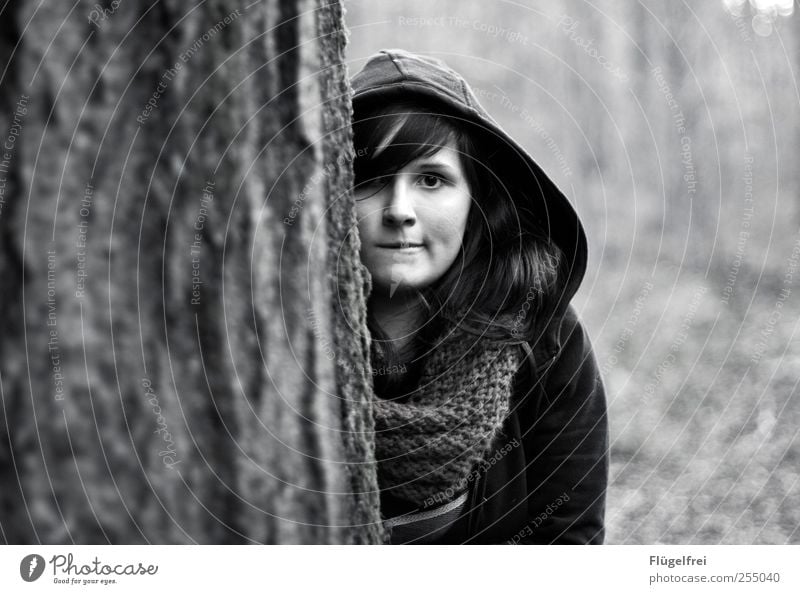 Inconspicuous? Feminine Young woman Youth (Young adults) 1 Human being Looking Hide Forest Tree Insecure Scarf Autumn Hooded (clothing) Shallow depth of field