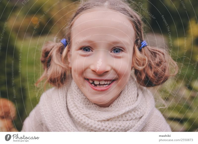 candid portrait of cute happy kid girl Lifestyle Joy Playing Knit Vacation & Travel Garden Child Nature Autumn Warmth Flower Leaf Sweater Scarf Smiling Funny