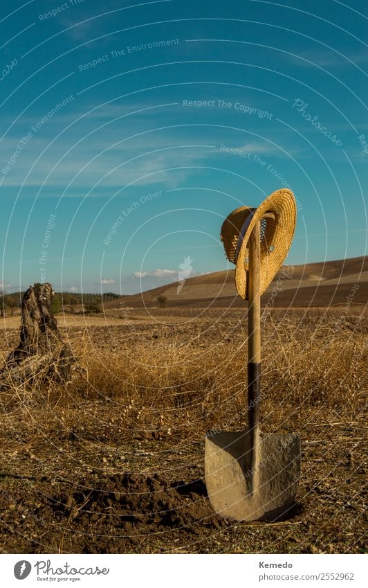 Wilderness field with a shovel and straw hat in a clear day. Lifestyle Wellness Harmonious Adventure Freedom Expedition Summer Sun Mountain Garden