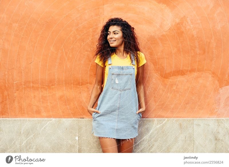 Smiling Arab Girl with black curly hairstyle looking left side Lifestyle Style Happy Beautiful Hair and hairstyles Face Tourism Human being Feminine Young woman