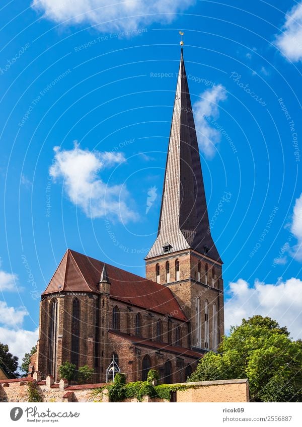 View of the Petrikirche in Rostock Tourism Clouds Tree Town Tower Building Architecture Tourist Attraction Old Historic Blue Belief Religion and faith