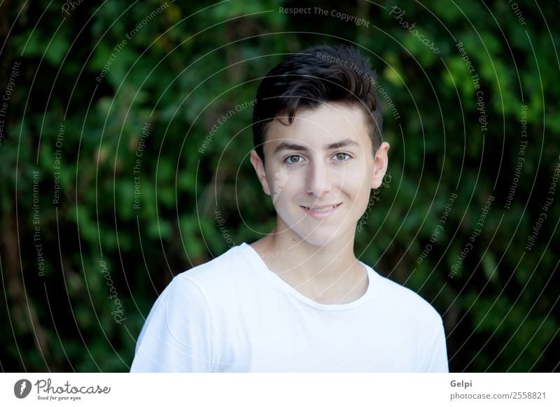 Handsome brown-haired teen in the park Lifestyle Style Happy Face Summer Human being Boy (child) Man Adults Youth (Young adults) Culture Nature Park Fashion