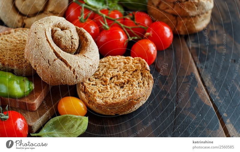 Frisella, typical south italian bread Vegetable Bread Wood Bright Green Red South Italian frisa frisella toasted dry Characteristic salento apulian Specialities