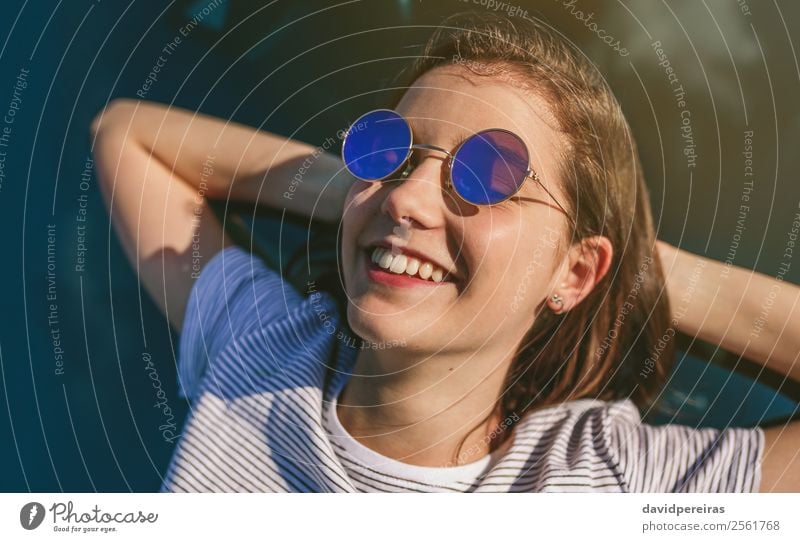 Young girl lying on the windshield Lifestyle Style Happy Beautiful Relaxation Calm Vacation & Travel Sunbathing Human being Woman Adults Youth (Young adults)