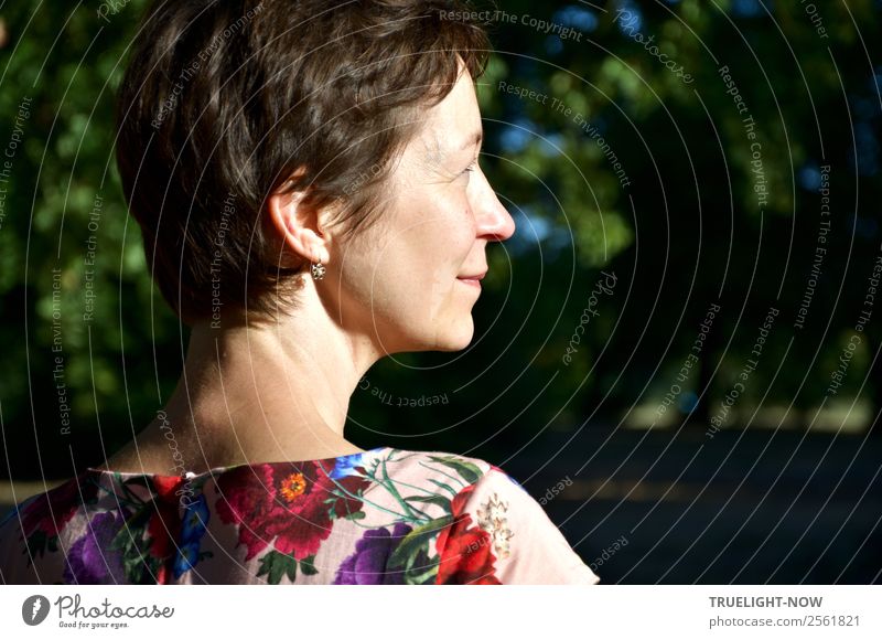 Sunlit woman's head in profile against a forest background Lifestyle Wellness Harmonious Well-being Contentment Relaxation Calm Human being Woman Adults Head