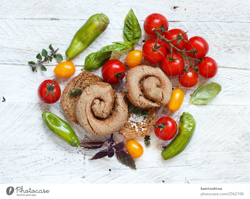 Frisella, typical south italian bread Vegetable Bread Wood Bright Green Red South Italian frisa frisella toasted dry Characteristic salento apulian Specialities