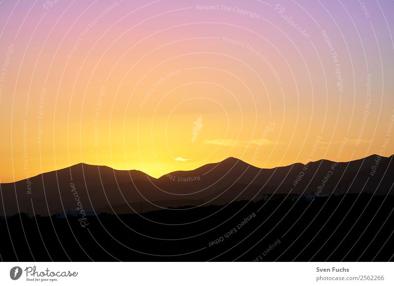 Sunset on Lanzarote Vacation & Travel Tourism Summer Mountain Nature Landscape Sky Horizon Sunrise Volcano Dark Blue Gold Orange Black Emotions Dusk panorama