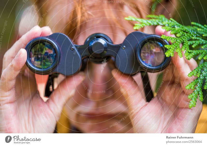 a woman looks disappointed through binoculars Human being Feminine Woman Adults Head 1 Red-haired Observe Emotions Moody Sadness Lovesickness Disappointment