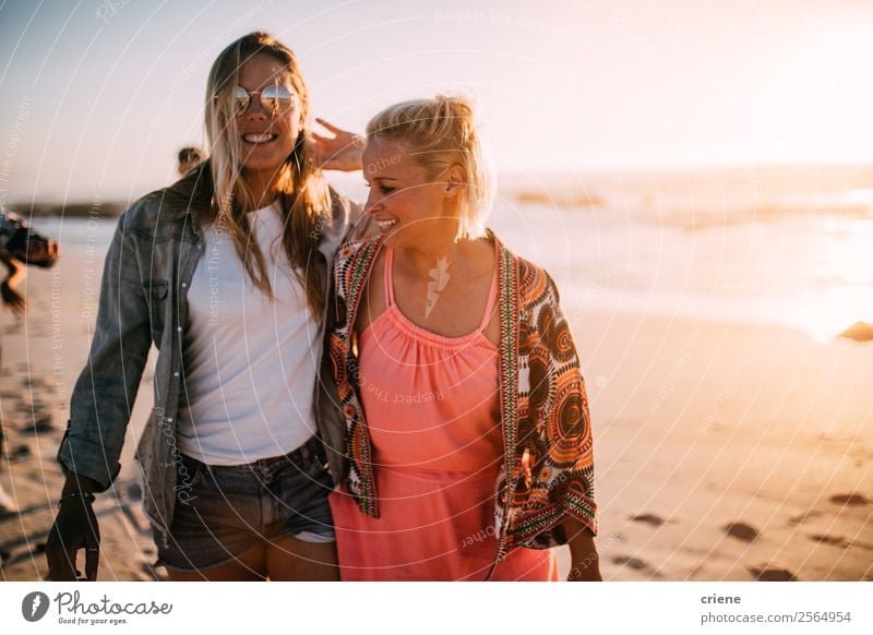 two happy women enjoy walking at beach with sunny weather Lifestyle Style Joy Happy Beautiful Leisure and hobbies Vacation & Travel Trip Summer Beach Ocean