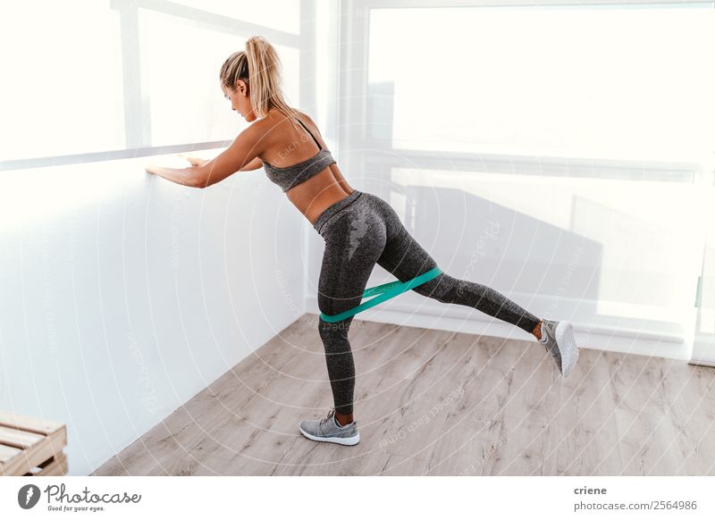 athletic young woman doing excercise with elastic band Lifestyle Beautiful Body Wellness Relaxation Sports Yoga Human being Woman Adults Band Underwear Movement