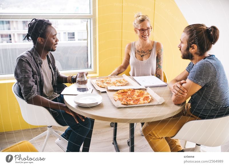 mixed race group of colleagues having pizza while working Eating Lunch Dinner Fast food Happy Beautiful Academic studies Work and employment Office Business