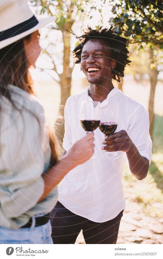 man and woman doing wine tasting outside Drinking Alcoholic drinks Lifestyle Happy Beautiful Summer Woman Adults Man Couple Nature Tree Park To enjoy Smiling