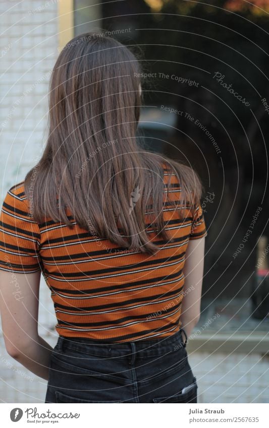 Shop window woman look Feminine Young woman Youth (Young adults) 13 - 18 years Town Downtown Window T-shirt Pants Brunette Long-haired Looking Thin Beautiful