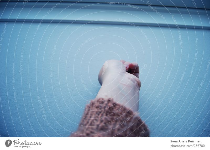 baby blue. Feminine Young woman Youth (Young adults) Arm Hand Fingers Wall (barrier) Wall (building) Cardigan To hold on Cold Colour photo Subdued colour