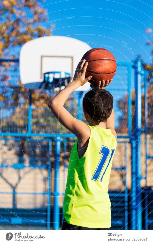 teenager throwing a basketball into the hoop from behind Lifestyle Joy Relaxation Leisure and hobbies Playing Sports Human being Boy (child) Man Adults Clothing