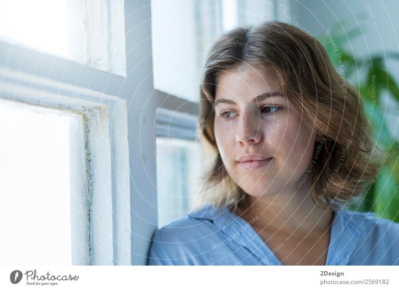 Woman leaning on a window, looking out of window Lifestyle Luxury Elegant Happy Beautiful Face Relaxation Leisure and hobbies Human being Feminine Young woman