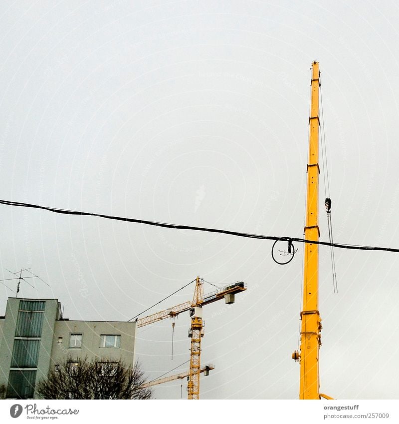 graphic construction site Construction machinery Crane Vienna Town Elevator Living or residing Construction site Construction crane Yellow Colour photo