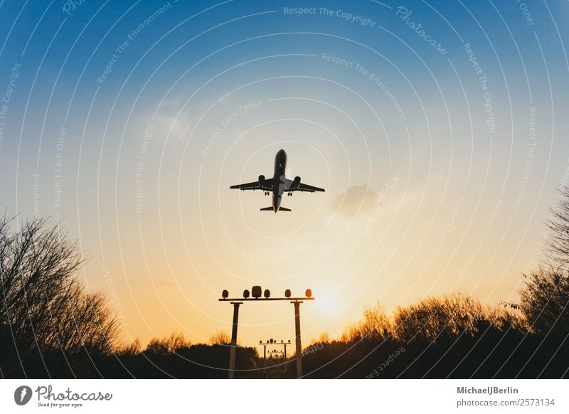 Airplane over signal systems in approach on airport Vacation & Travel Dark International Sunset Logistics Transport Airplane landing Airport Back-light Safety