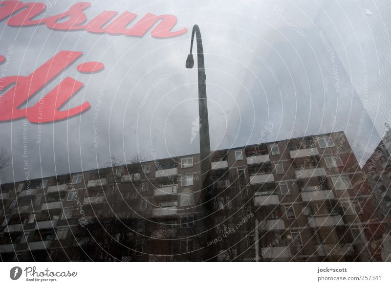 Detail of facade on the glass pane Trade Typography Sky Bad weather Kreuzberg Town house (City: Block of flats) Facade Pane Characters Dark Gray Lamp post