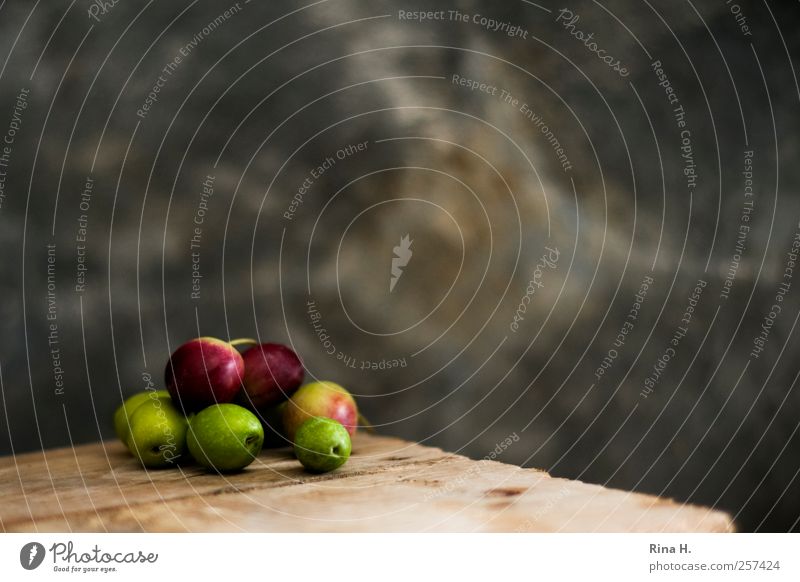 Olives II Nutrition Vegetarian diet Mediterranean Authentic Simple Delicious Warmth Thrifty Wooden table Red Green Colour photo Interior shot Deserted