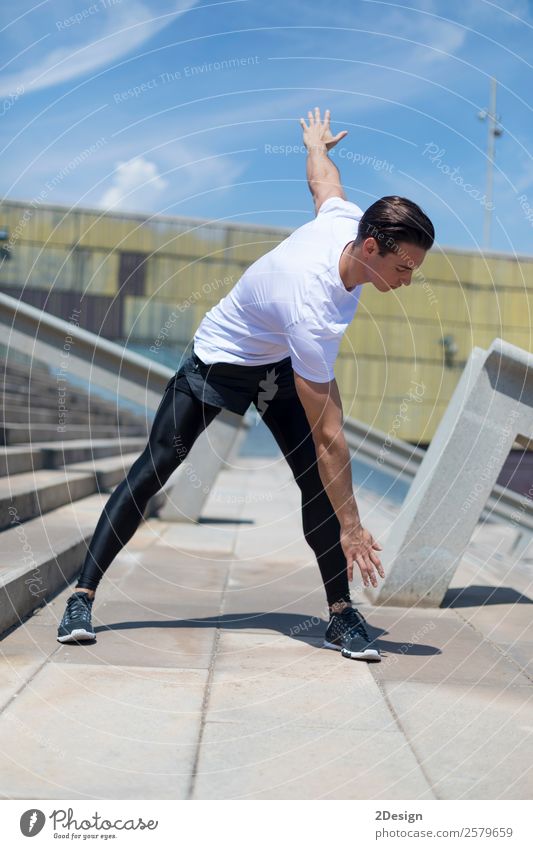 Muscular man stretching outdoors Lifestyle Body Relaxation Summer Sports Human being Masculine Man Adults Fitness Jump Strong Black Self-confident Power Effort