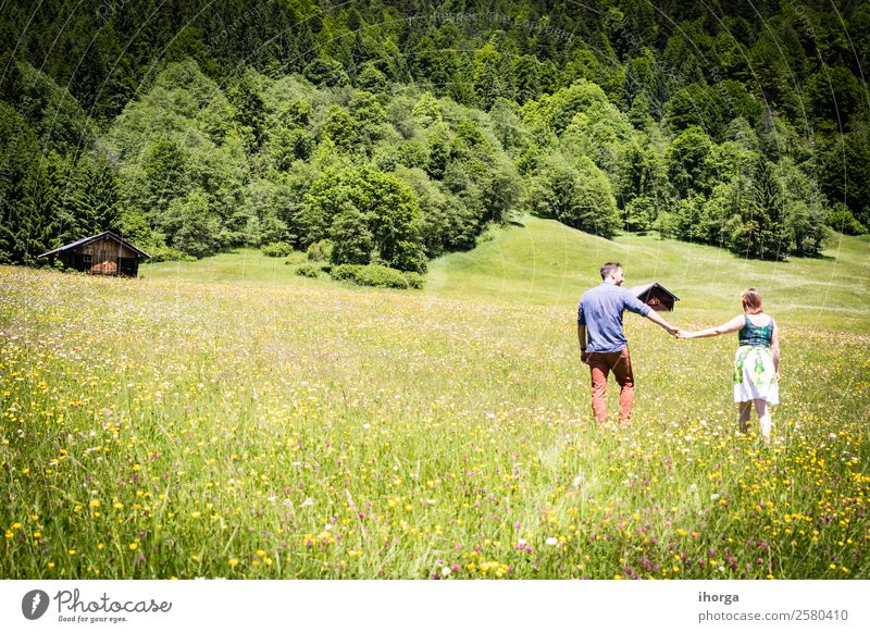 happy lovers on Holiday in the alps mountains Lifestyle Happy Beautiful Relaxation Vacation & Travel Adventure Summer Mountain Woman Adults Man Couple Partner