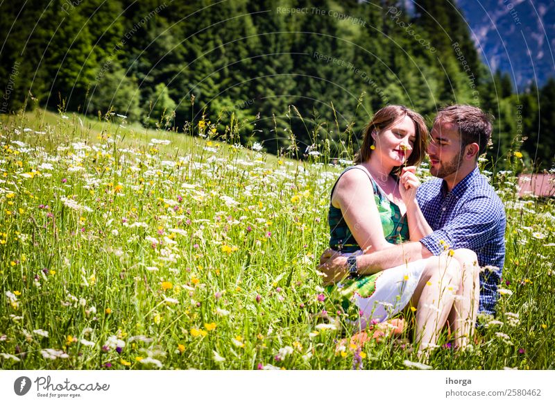 happy lovers on Holiday in the alps mountains adventure background beautiful cheerful countryside couple europe female field flower forest girl green hands