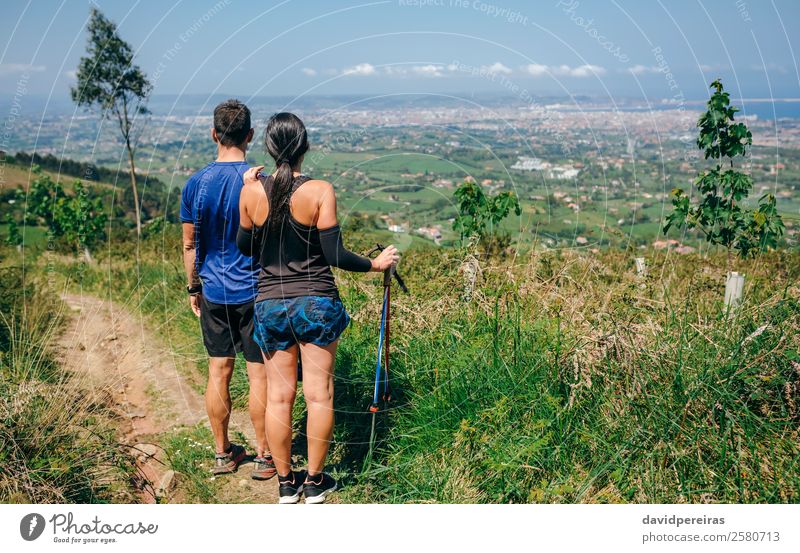 Couple stopping to look the views while doing trail Lifestyle Adventure Sports Human being Woman Adults Man Nature Tree Forest Lanes & trails Observe Stand