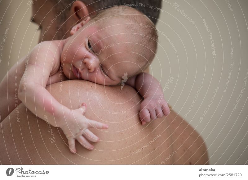 Father holding newborn baby son at the day time. Concept of happy family. Lifestyle Joy Happy Relaxation Leisure and hobbies Playing Vacation & Travel Freedom