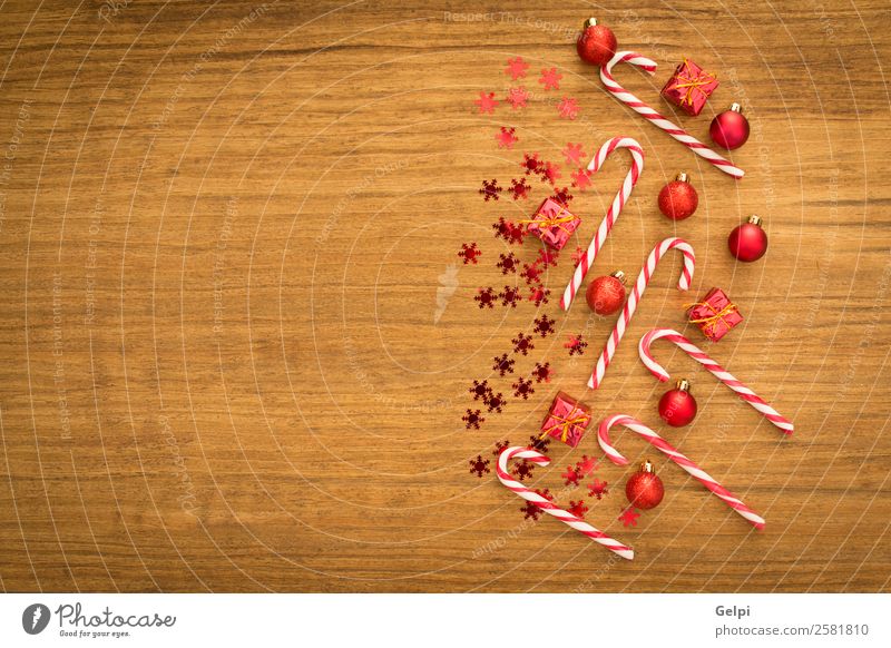 Candy canes with Christmas balls Dessert Design Joy Happy Winter Decoration Feasts & Celebrations Christmas & Advent Wood Ornament Stripe Bright Red White