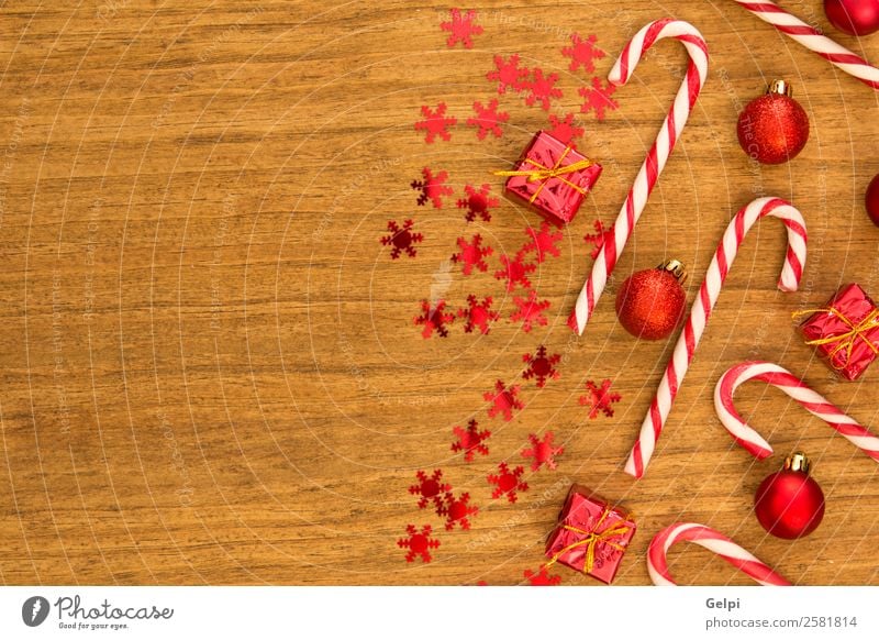 Candy canes with Christmas balls Dessert Design Joy Happy Winter Decoration Feasts & Celebrations Christmas & Advent Wood Ornament Stripe Bright Red White