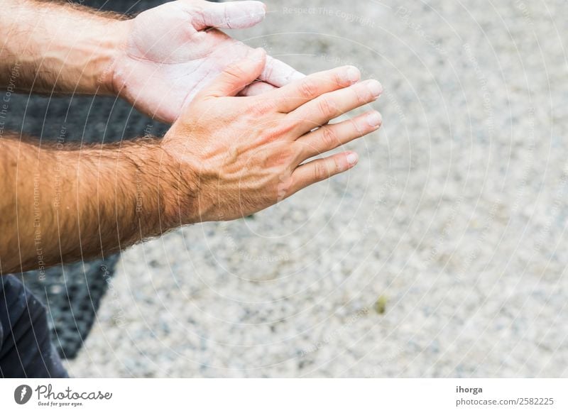 A Man practicing rock climbing on artificial wall indoors Lifestyle Joy Leisure and hobbies Sports Climbing Mountaineering Adults Hand Fingers 1 Human being