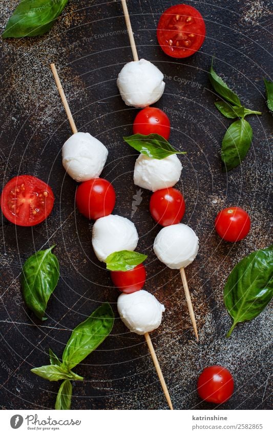 Italian cheese mozzarella with tomatoes, basil and olive oil Nutrition Vegetarian diet Ball Dark Fresh Bright Delicious Soft Green Red White Tradition Meal