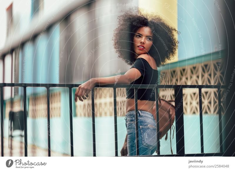 Young mixed woman with afro hair standing on the street. Lifestyle Style Beautiful Hair and hairstyles Face Human being Feminine Young woman