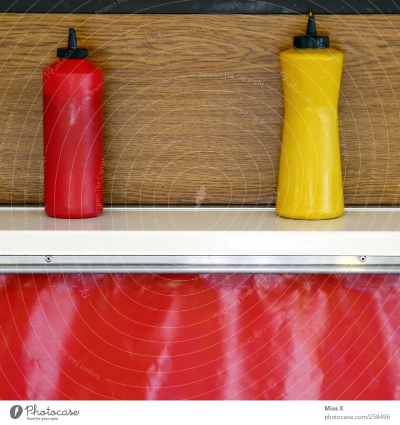 Ketchup & Mustard Food Nutrition Fast food Yellow Red Snack bar sausage stall Stalls and stands Bottle Tangy Colour photo Multicoloured Close-up Deserted