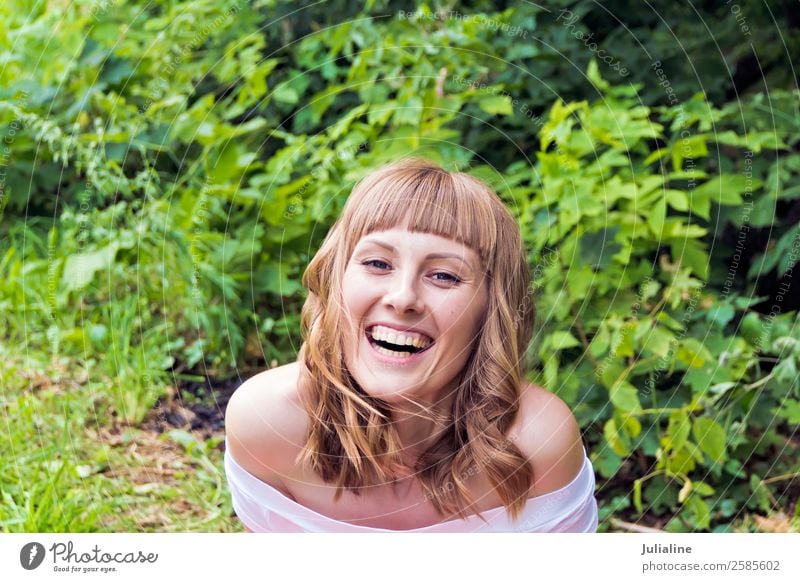 portrait of laughing woman with blond hair on summer background Eating Happy Hair and hairstyles Make-up Summer To talk Woman Adults 18 - 30 years