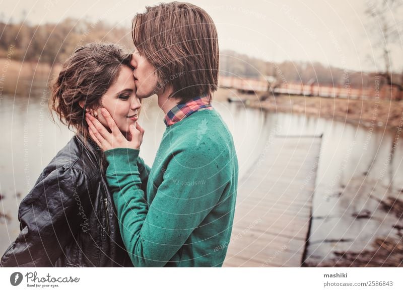 happy young couple kissing on the walk Joy Happy Beautiful Vacation & Travel Woman Adults Man Family & Relations Friendship Couple Tree Forest Kissing Smiling