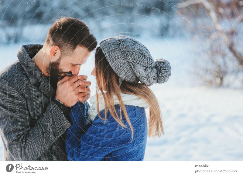 lifestyle shot of happy couple walking in snowy forest Lifestyle Joy Leisure and hobbies Vacation & Travel Freedom Winter Snow Man Adults Couple Fashion Scarf