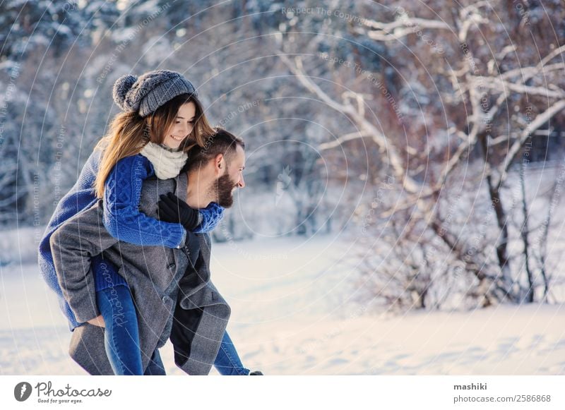 happy loving couple walking in snowy winter forest Lifestyle Joy Leisure and hobbies Vacation & Travel Freedom Winter Snow Man Adults Couple Forest Hat Beard