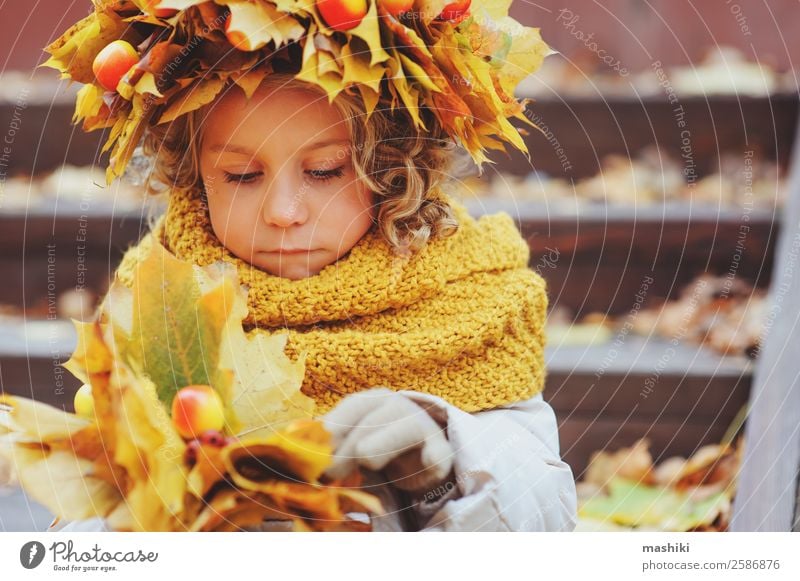 cute child girl on autumn walk in wreath Child 3 - 8 years Infancy Adventure Autumn Walking Orange Warmth Nature Childhood dream Girl Leaf Seasons Cute Small