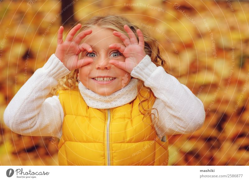 happy kid girl playing in autumn park Lifestyle Joy Leisure and hobbies Vacation & Travel Adventure Freedom Sun Human being Child Girl Infancy Nature Autumn